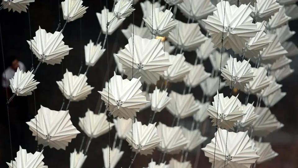 An installation photograph of small, geometric sculptures.