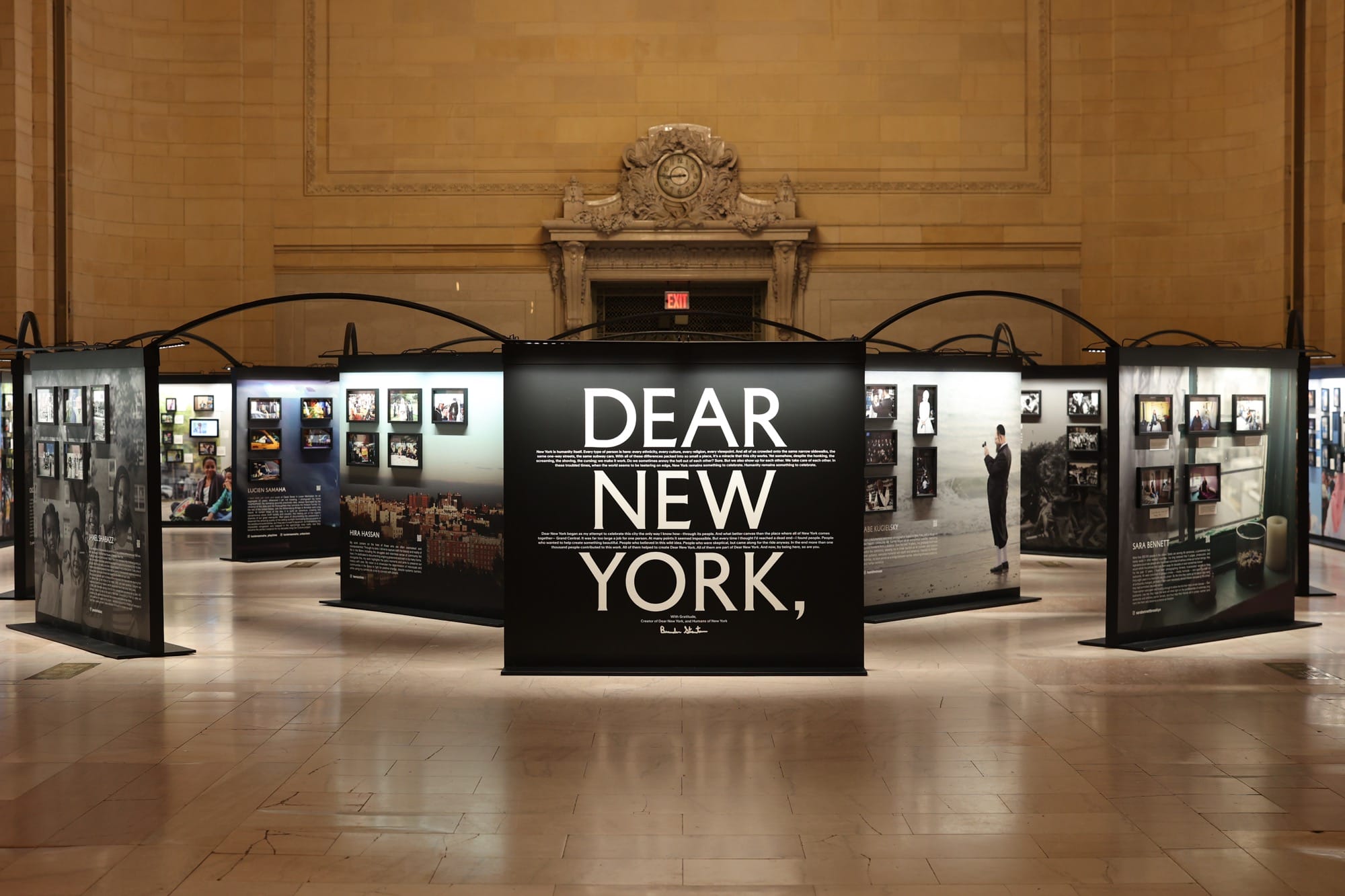 a photo installation of Brandon Stanton's Dear New York within Grand Central Station