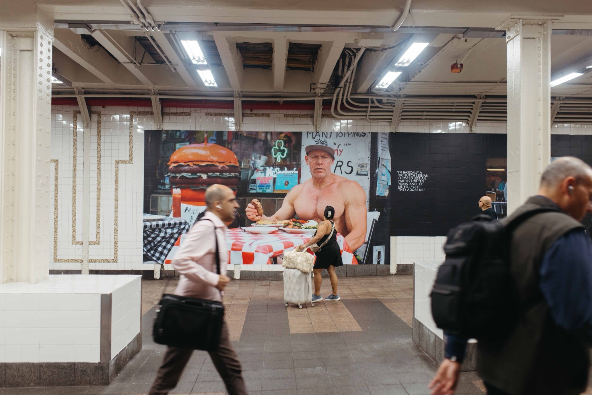 a photo installation of Brandon Stanton's Dear New York in the subway