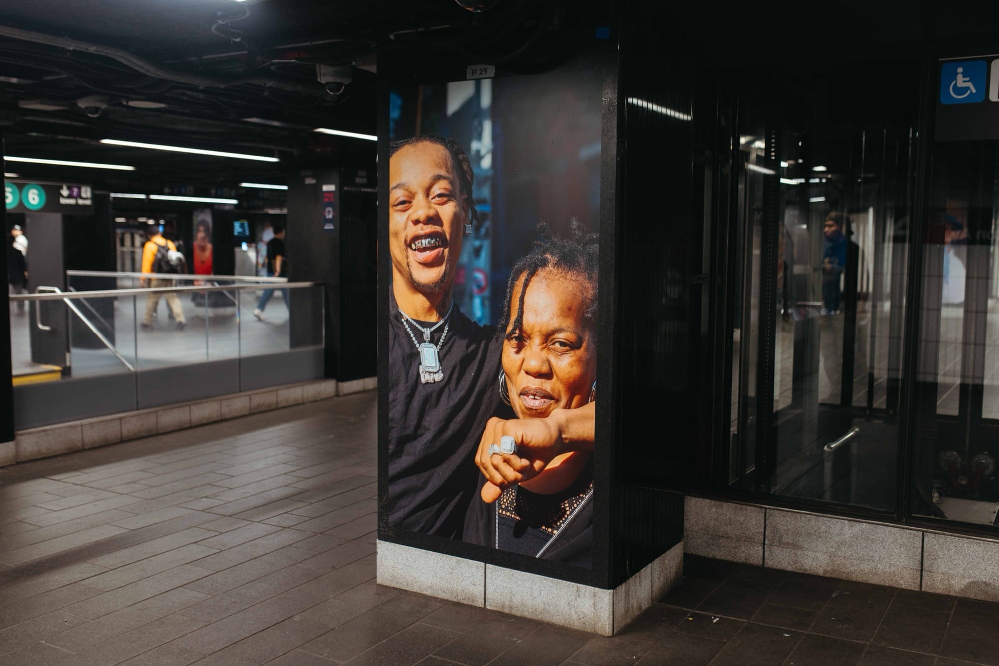 a photo installation of Brandon Stanton's Dear New York in the subway