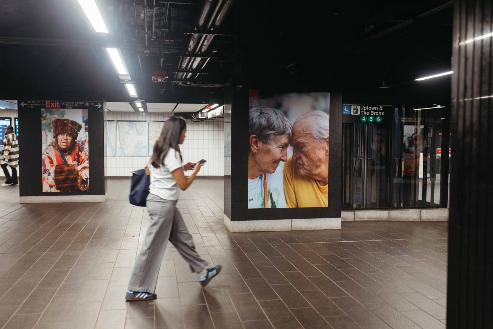 a photo installation of Brandon Stanton's Dear New York in the subway