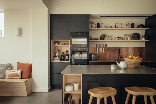 Inside there are spacious areas for cooking and entertaining, a connection to the garden, and humble materials like corten steel, CNC-cut plywood, and cement.