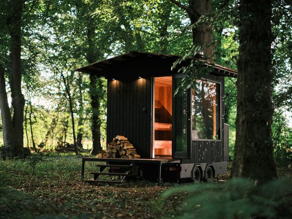 It’s clad in <i>yakisugi, </i>or charred timber, and has mechanical eaves and a deck that can be deployed.