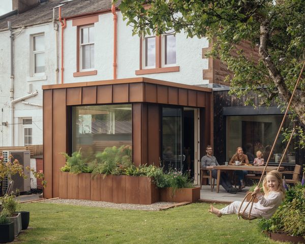 James and Fenella stripped the house back to its brickwork, integrated a new corten steel- and burnt larch–clad extension with a kitchen, living, and utility spaces on the ground floor, and refurbished an underused conservatory.