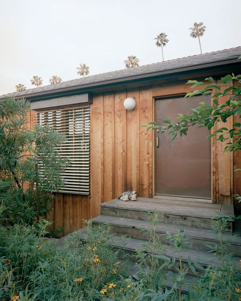 Redwood siding lends TK. "We wanted to slowly gain some presence in the community and not come in swinging,