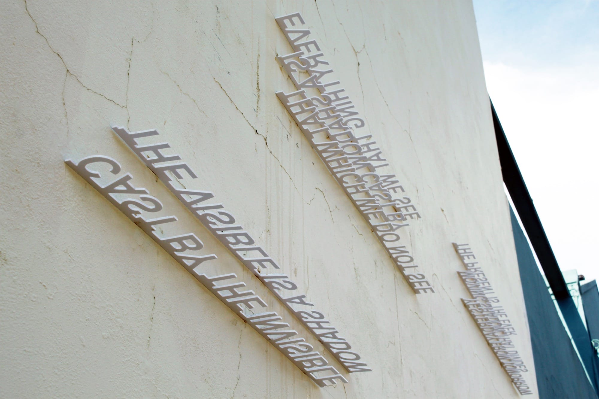 Strijdom van der Merwe's text installation on a white wall