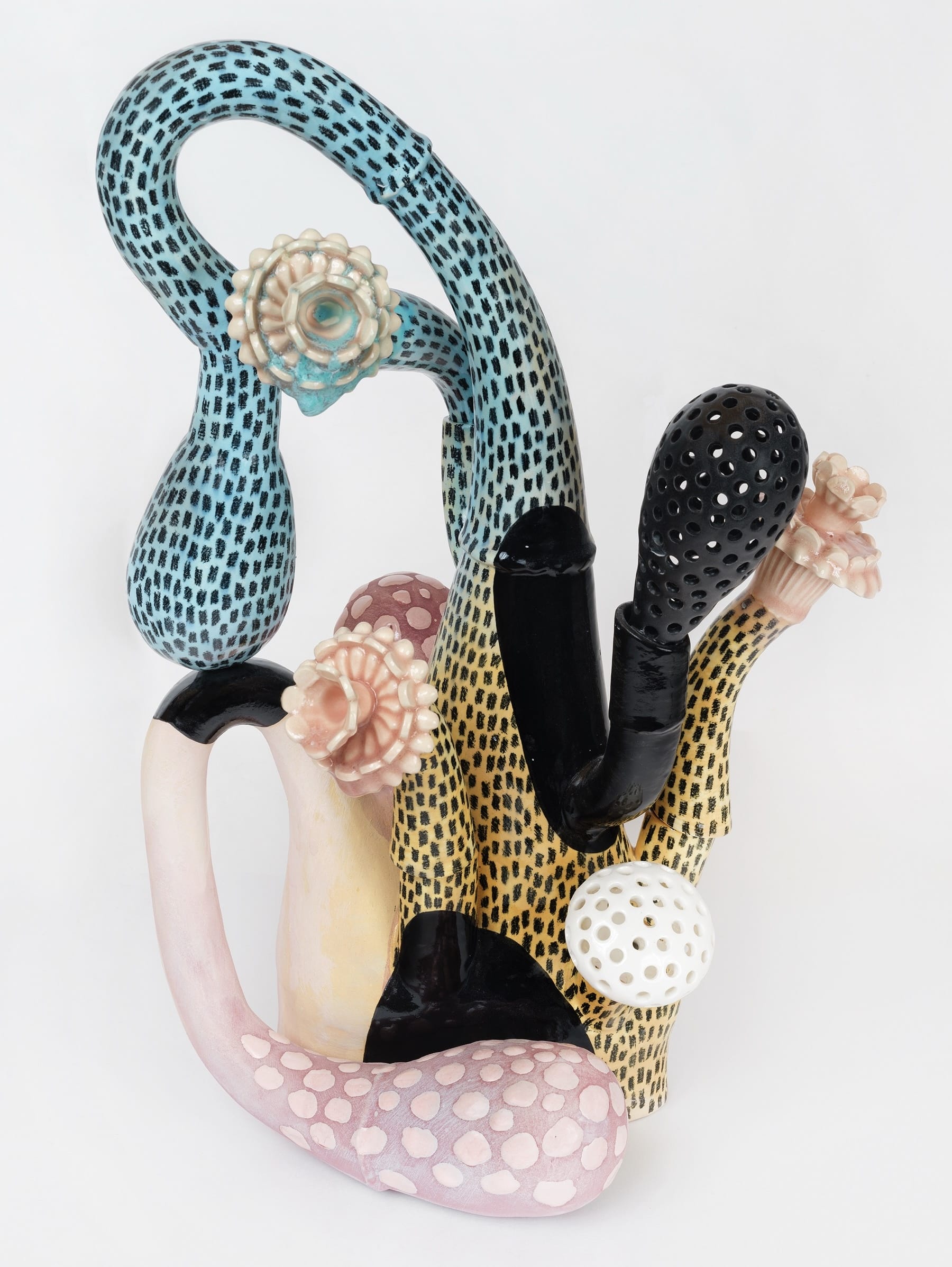 a ceramic sculpture by Megan Bogonovich resembling an abstract, otherworldly plant or flower