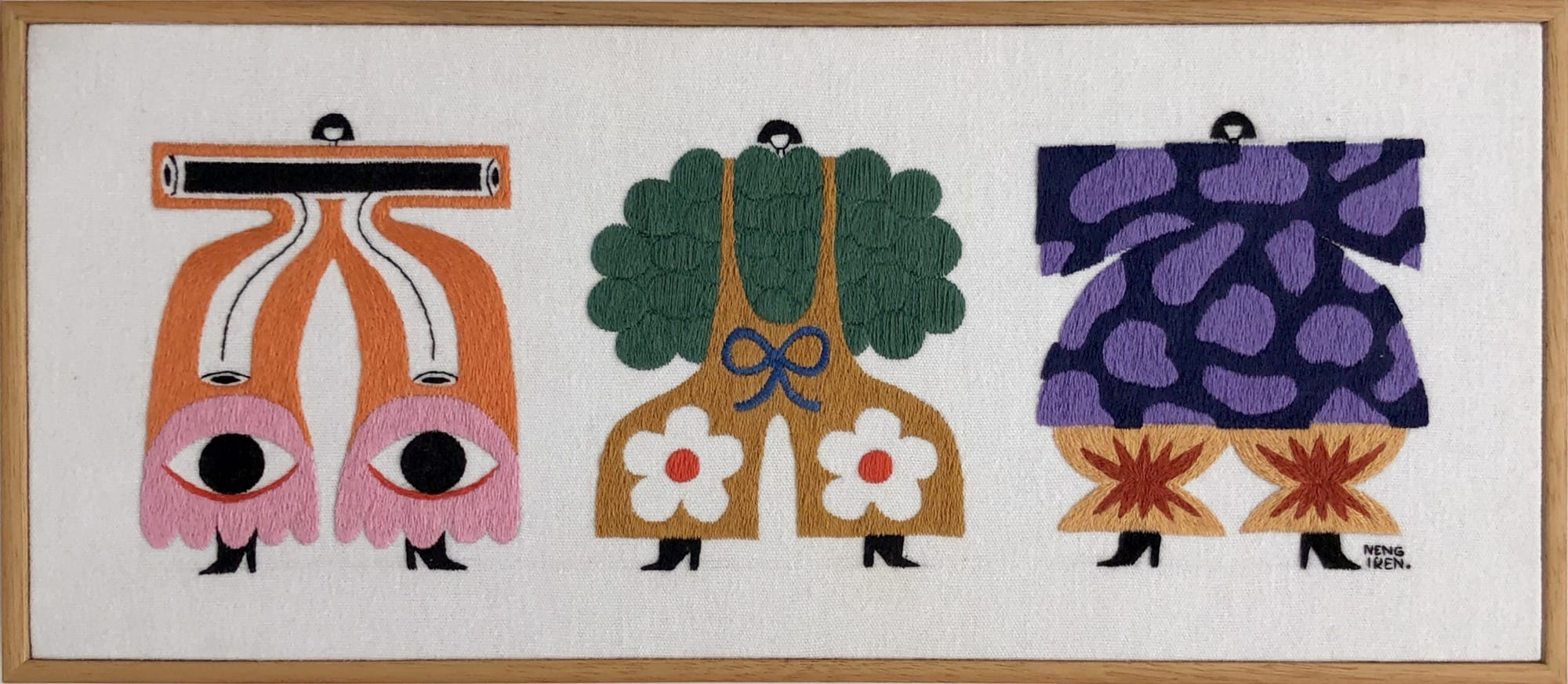 an embroidered artwork by Irene Saputra of three colorful, patterned, symmetrical, abstractly shaped figures