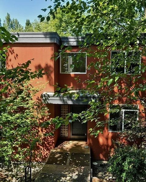 Before: Eric and Kristin Courtemanche bought this 1990 house in Seattle in 2015. They worked with SHED Architecture & Design on a whole house remodel. SHED removed the cornice at the roof to crisp the exterior lines and remediate the roof assembly.