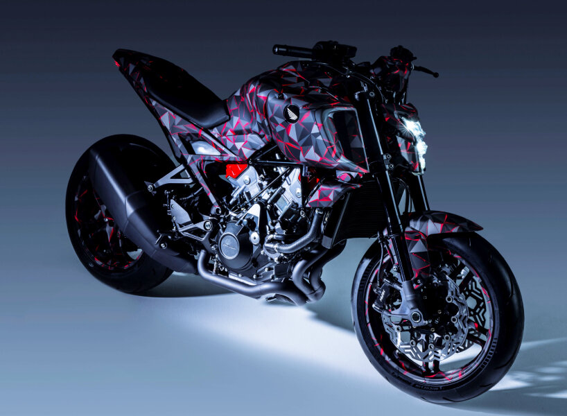 the fuel tank and seat structure are shaped to fit the rider’s posture