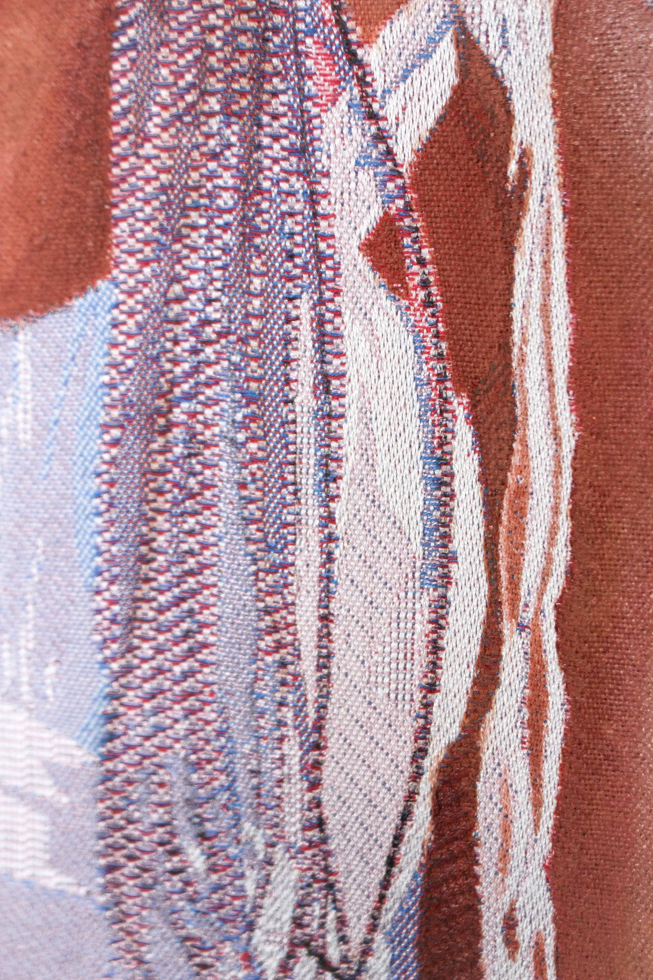 a detail of a woven Jacquard tapestry by Malaika Temba showing the texture of long braids